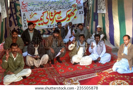 QUETTA, PAKISTAN - DEC 05: Members of Socio Economic Development Association  (SEDA) Employees Union chant slogans against non-issue their dues salaries on December 05, 2014 in Quetta.