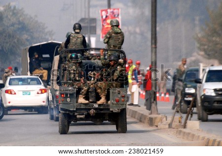 PESHAWAR, PAKISTAN - DEC 16: Security personnel cordon off venue and conducted an operation against militants after militants attacked an Army Public School situated on December 16, 2014 in Peshawar.