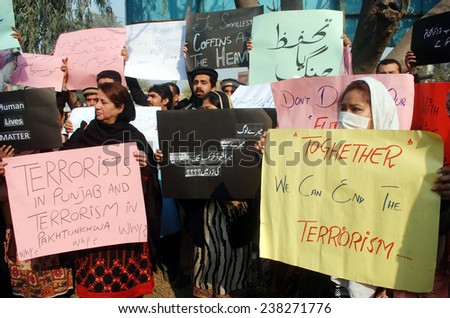 PESHAWAR, PAKISTAN - DEC 17: Members of CS chant slogans against killing of innocent school children and staff members of Army Public School in Taliban terror attack on December 17, 2014 in Peshawar.