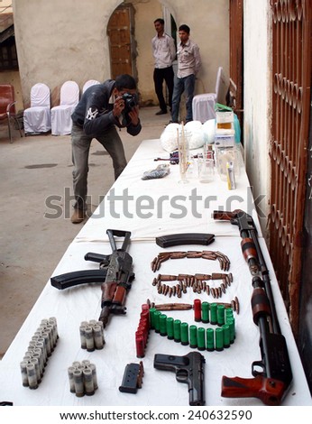 KARACHI, PAKISTAN - DEC 30: Weapons and explosive materials recovered by CID from criminal associated with defunct Tehreek-e-Talban are being exposing to media persons on December 30, 2014 in Karachi.