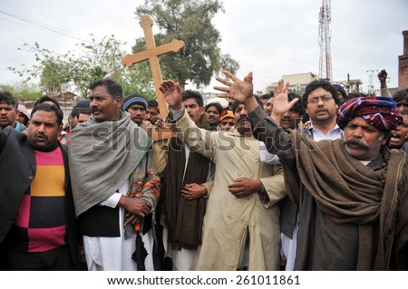 PESHAWAR, PAKISTAN - MAR 16: Christian Community chant slogans against Twin blasts targeted the Roman Catholic Church and Christ Church in Youhanabad area of Lahore on March 16, 2015 in Peshawar.