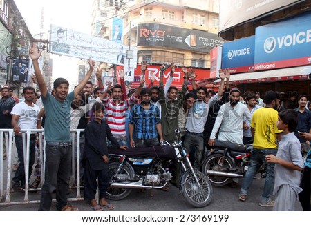 KARACHI, PAKISTAN - APR 28: Mobile phone wholesalers of Saddar Mobile Market are  protesting against detention of vendors by Police, at Abdullah Haroon Raod on April 28, 2015 in Karachi.