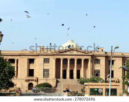 KARACHI, PAKISTAN - MAY 14: National Flag hoist-down during a mourn day against attack on Ismaili Community, at High Court Sindh on May 14, 2015 in Karachi.