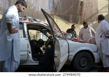 QUETTA, PAKISTAN - MAY 19: Custom Intelligence officials show hug quantity of seized drugs to media persons that were recovered from vehicle in snap-checking on May 19, 2015 in Quetta.