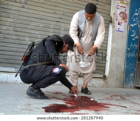 QUETTA, PAKISTAN - MAY 25: Security staffs gathering outside Saleem Medical Complex where unidentified gunmen assassinated a woman and man belong to Shia Hazara Community on May 25, 2015 in Quetta.