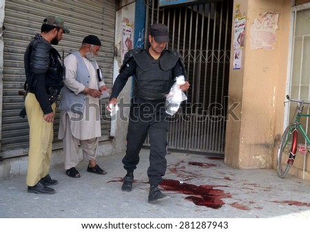 QUETTA, PAKISTAN - MAY 25: Security staffs gathering outside Saleem Medical Complex where unidentified gunmen assassinated a woman and man belong to Shia Hazara Community on May 25, 2015 in Quetta.