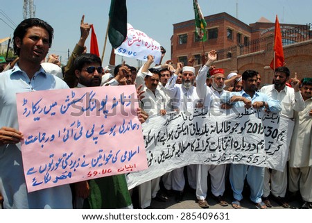 PESHAWAR, PAKISTAN - JUN 08: Candidates and residents of UC-55 chant slogans against local government election during protest demonstration press club on June 08, 2015 in Peshawar.