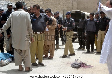 QUETTA, PAKISTAN - JUN 11: Security staffs cordon off venue after killing of four policemen in an opened fire by unknown assailants at Manan Chowk on Thursday, June 11, 2015.