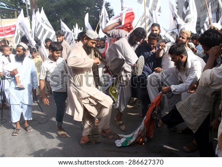 KARACHI, PAKISTAN, JUN 12: Activists of Jamat-ud-Dawah are protesting against India and massacre of Muslims by Buddhist in Burma during a rally on June 12, 2015 in Karachi.