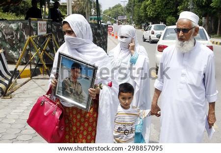 PESHAWAR, PAKISTAN - JUL 22: Relatives of Army Public School massacre victims, arrive for attend memorial ceremony to express solidarity with martyrs school children on July 22, 2015 in Peshawar.