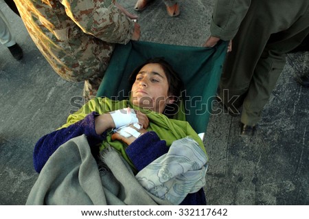 PESHAWAR, PAKISTAN - OCT 27: Injured victim of strong earthquake evacuated from \
Chitral to Hospital during Rescue operation by Pakistan Army, on October 27, 2015 in Peshawar.