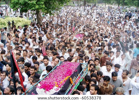 LAHORE, PAKISTAN, SEPT 02: People carry coffins of those, who were lost their life in bomb explosions yesterday, for burial after their funeral prayerLAHORE, PAKISTAN-SEPT 02: People carry coffins of those, who were lost their life in bomb explosions yest