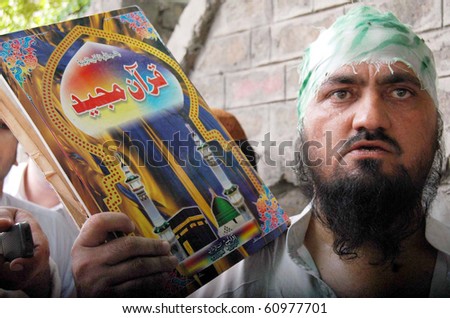 PESHAWAR, PAKISTAN - SEPT 9: Residents of Dir Colony are protesting against  desecration of the Holy Quran in US in front of US Consulate in Peshawar, Pakistan on Thursday, September 9, 2010