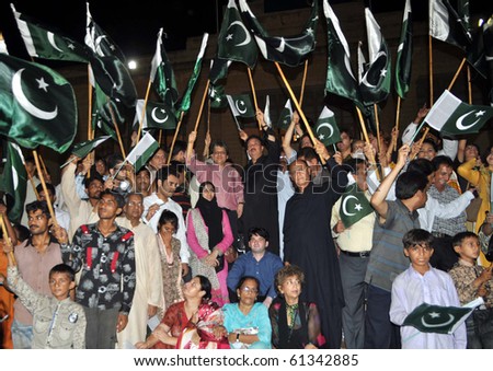 KARACHI, PAKISTAN-SEPT 14: Flood victims sing National Song with Sindh Governor, Dr.Ishrat-ul-Ibad Khan during a ceremony held at Governor House in Karachi on Tuesday, September 14, 2010