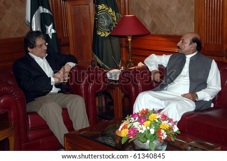 KARACHI, PAKISTAN-SEPT 17: Sindh Governor, Dr.Ishrat-ul-Ibad Khan exchanges views with Chief Minister, Syed Qaim Ali Shah during meeting at Governor House Sept 17, 2010 in Karachi
