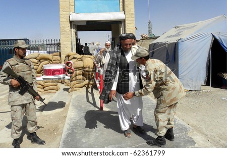 CHAMAN, PAKISTAN, OCT 04: Army officials take body search of people who are entering in Pakistan from Afghanistan through Pak-Afghan border on October 4, 2010 in Chaman, Pakistan.