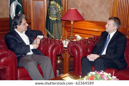 KARACHI, PAKISTAN, OCT 04: Sindh Governor, Dr.Ishrat-ul-Ibad Khan exchanges views with Switzerland Consul General, Didier Boschung during meeting at Governor House on October 4, 2010 in Karachi, Pakistan.