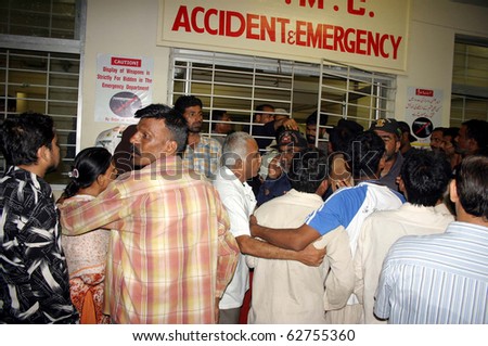 KARACHI, PAKISTAN - OCT 07: People gather at Jinnah hospital after two bomb explosions on October 07, 2010 in Karachi, Pakistan