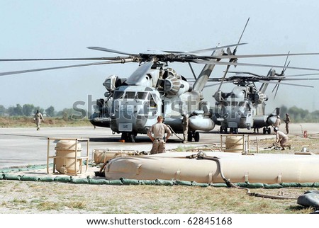 PANO AKIL, PAKISTAN - OCT 11: US helicopters ready for supply of relief goods to flood affectees on October 11, 2010 at Pano Akil Cantt, Pakistan.