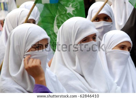ISLAMABAD, PAKISTAN - OCT 11: Veiled women supporters of Jamat-e-Islami, (JI) listen speech of their leaders during Yakjehti (Solidarity) Kashmir rally  on October 11, 2010 in Islamabad, Pakistan.