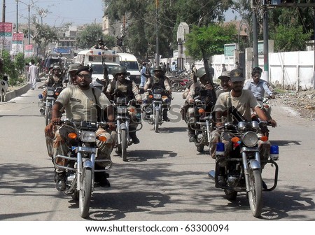 KARACHI, PAKISTAN - OCT 17: Rangers convoy patrols to avoid any untoward incident in Orangi Town as security has been tightened during the by-election for PS-94, on October 17, 2010 in Karachi.
