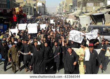 CHAMAN, PAKISTAN - OCT 18: Students of the Government High Schools pass through a road during protest rally against the poor education in Qila Abdullah on October 18, 2010 in Chaman, Pakistan.