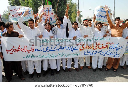 PESHAWAR, PAKISTAN - OCT 25: Peoples Students Federation (PSF) activists shout slogans against Nawabzada Mehmood Zaib during a protest demonstration at press club on October 25, 2010 in Peshawar, Pakistan.