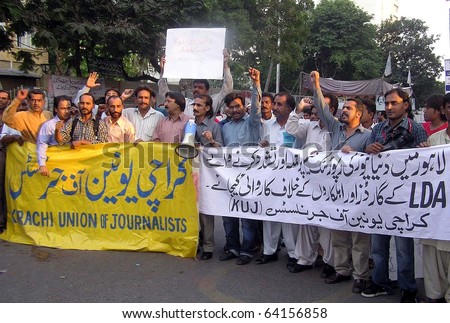 KARACHI, PAKISTAN - OCT 30: Members of Karachi Union of Journalists (KUJ) are protesting against torture on journalists during a demonstration at press club on October 30, 2010 in Lahore.