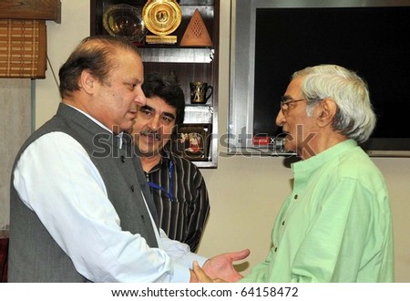 LAHORE, PAKISTAN - OCT 31: Muslim League-N Chief, Nawaz Sharif, inquires about the health of Senior Journalist, Munno Bhai, during meeting on October 31, 2010 in Lahore.