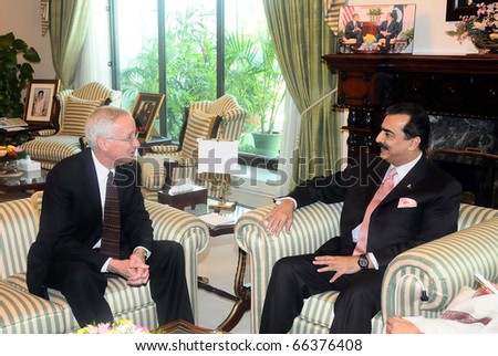 ISLAMABAD, PAKISTAN - DEC 01: Prime Minister, Syed Yousuf Raza Gilani, exchanges views with US Ambassador, Cameron P.Munter, during meeting at PM House on December 01, 2010 in Islamabad, Pakistan.