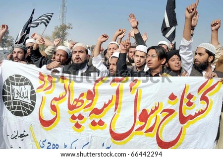 PASHAWAR, PAKISTAN - DEC 02: Activists of Jamiat Ulema Islam are protesting demanding execution of Asia Bibi during demonstration on December 02, 2010 in Peshawar, Pakistan.