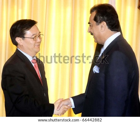 ISLAMABAD, PAKISTAN - DEC 02: Prime Minister, Syed Yousuf Raza Gilani, shakes hand with Gao Hucheng, International Trade Representative of China, during meeting on December 2, 2010 in Islamabad, Pakistan.