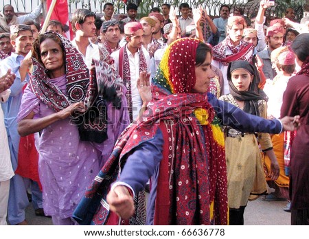 HYDERABAD, PAKISTAN - DEC 05: People celebrate the Sindhi Cap and Ajrak Day during rally on December 05, 2010 in Hyderabad, Pakistan.