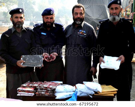 PESHAWAR, PAKISTAN - DEC 13: Pakistan Custom officials showing seize Drugs during a press conference on December 13, 2010 in Peshawar, Pakistan