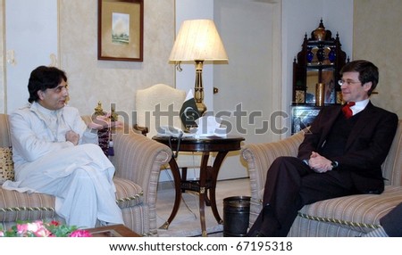 ISLAMABAD, PAKISTAN - DEC 13: Muslim League-N leader Ch.Nisar Ali Khan, in meeting with British High Commissioner to Pakistan Adam Thomson at Punjab House on December 13, 2010 in Islamabad, Pakistan.