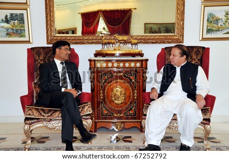 LAHORE, PAKISTAN - DEC 14: Muslim League-N Chief, Nawaz Sharif exchanges views with India High Commissioner, Sharat Sabharwal, during meeting on December 14, 2010 in Lahore.