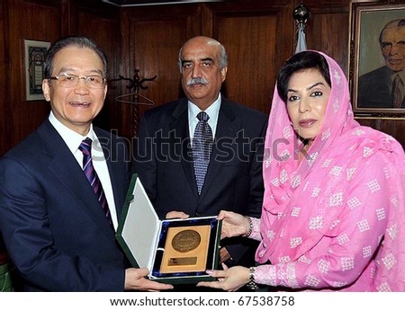 ISLAMABAD, PAKISTAN - DEC 19: National Assembly Speaker, Dr.Fehmida Mirza, presents gift to China Prime Minister, Wen Jaibao upon, his arrival at Parliament House on December 19, 2010 in Islamabad.