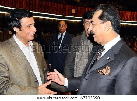 ISLAMABAD, PAKISTAN - DEC 22: Prime Minister, Syed Yousuf Raza Gillani, talks with Muslim League - Ch.Pervez Elahi, on occasion of the National Assembly Session on December 22, 2010 in Islamabad, Pakistan.