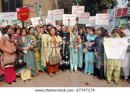 LAHORE, PAKISTAN - DEC 23: Women activists of Muslim League-N chant slogans in favor of Begum Kulsoom Nawaz during demonstration on occasion of Women Convention on December 23, 2010 in Lahore.
