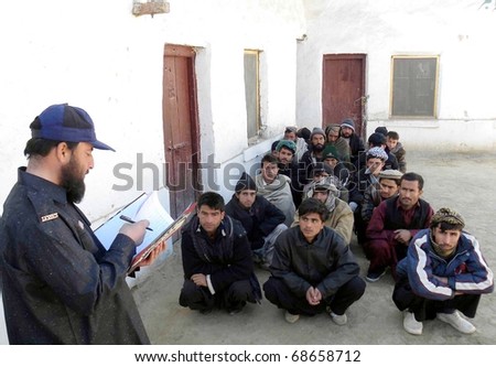 CHAMAN, PAKISTAN - JAN 09: Afghan nationals who were arrested at Pak-Afghan border when they were entering in Country without legal documents, sit at police station on January 09, 2011in Chaman.