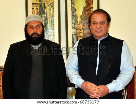 LAHORE, PAKISTAN - JAN 10: Group photo of Muslim League-Chief Nawaz Sharif, with Sajjada Nashin (custodian) of Sultan Baho Shrine, Sultan Fayaz-ul-Hassan after meeting on January 10, 2011in Lahore.