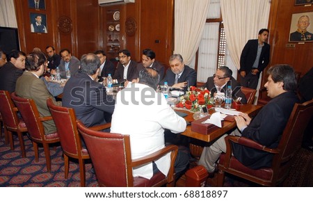 KARACHI, PAKISTAN - JAN 11: Sindh Governor, Dr.Ishrat-ul-Ibad Khan, presides over meeting to review KESC and SSG Affairs held at Governor House on January 11, 2011in Karachi.