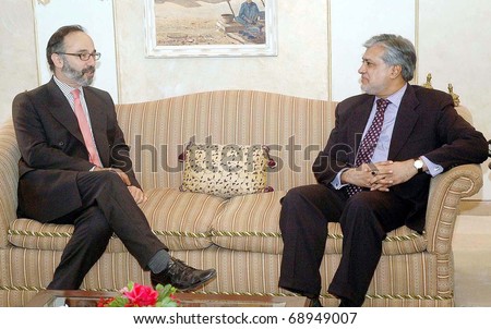 ISLAMABAD, PAKISTAN - JAN 13: Muslim League-N leader, Muhammad Ishaq Dar, talks with UK Deputy High Commissioner, Peter Tibber during meeting at Punjab House on January 13, 2011in Islamabad.