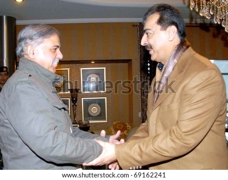 LAHORE, PAKISTAN - JAN 16: Prime Minister, Syed Yousuf Raza Gilani, shakes hands with Punjab Chief Minister, Shahbaz Sharif during meeting on January 16, 2011in Lahore, Pakistan.
