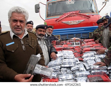 QUETTA, PAKISTAN - JAN 16: Customs officials show seized Charas (drugs) during press conference at Baleli check-post on January 16, 2011 in Quetta, Pakistan.