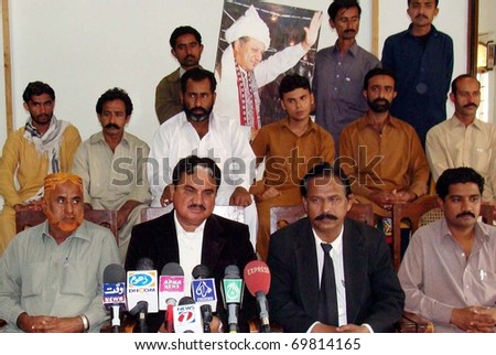 HYDERABAD, PAKISTAN - JAN 23: Muslim League-N Sindh Organizing Committee member, Afzal Gujar along with Sultan Sheikh Advocate addresses press conference on January 23, 2011in Hyderabad.