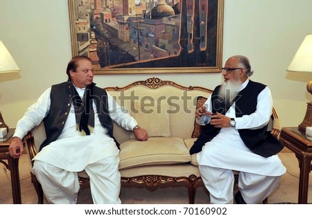 LAHORE, PAKISTAN - JAN 30: Muslim League-N Chief, Nawaz Sharif talks with PML-N UAE President, Ch.Altaf during meeting on January 30, 2011in Lahore.