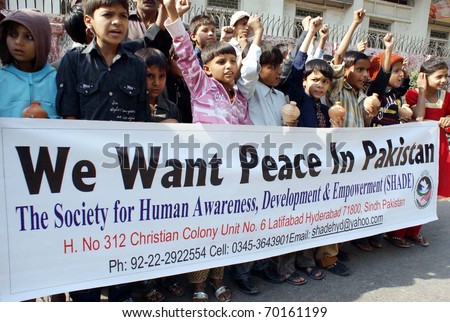 HYDERABAD, PAKISTAN - JAN 30: Supporters of Society for Human Awareness,  Development and Empowerment (SHADE) chant slogans in favor of Peace during rally on January 30, 2011in Hyderabad.