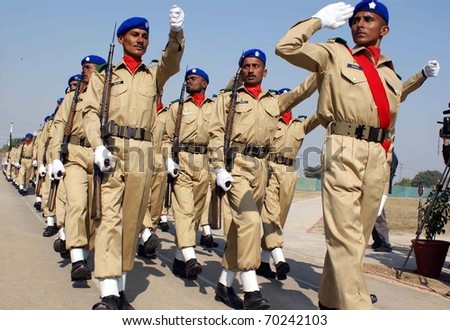 HYDERABAD, PAKISTAN - JAN 31: Recruits march-past on occasion of the passing out parade ceremony of four hundred and fifty recruits held at Hyderabad Garrison on January 31, 2011in Hyderabad.