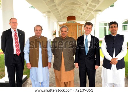 LAHORE, PAKISTAN - FEB 27: Muslim League-N Chief, Nawaz Sharif in group photo with UK High Commissioner, Adam Thomson during meeting on February 27, 2011in Lahore.